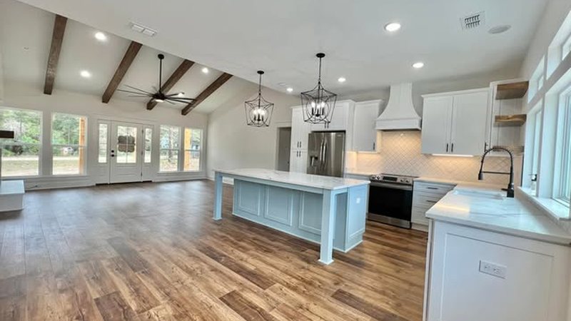 Open-concept living room and kitchen in a JSR Construction custom build